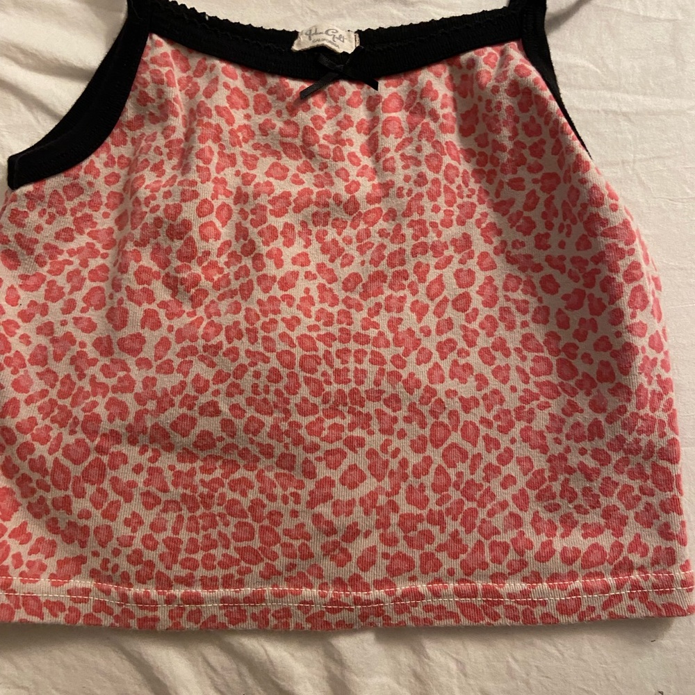 Pink and white Cheetah print top, with black edges